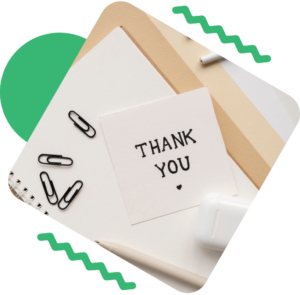A thank you note with the words "Thank You" written on it.
